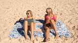 Two women relaxing on a Nakie XL beach towel Nakie - Australia