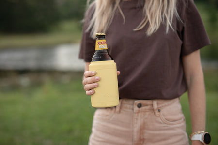 Daisy Yellow Cooler & Coffee Cup holding a beer bottle